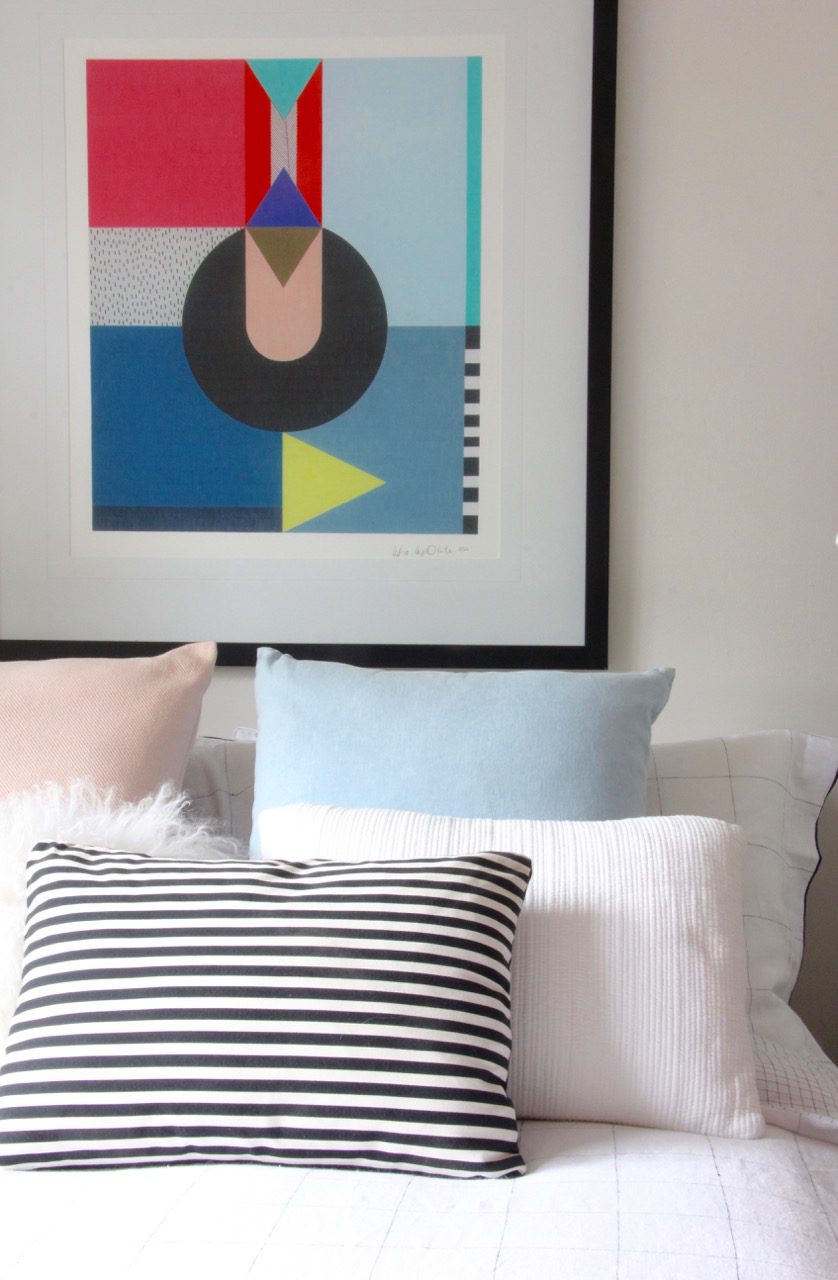 Bedroom colourful art and striped pillow