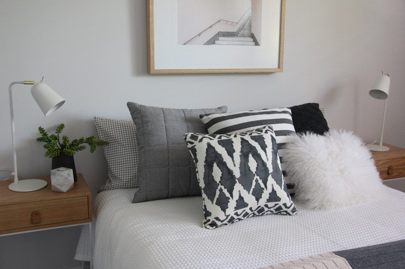 Lush bedroom styling with 5 throw pillows